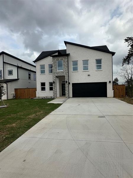 Front exterior of a new home in , Dallas, TX, highlighting curb appeal (Image 15).