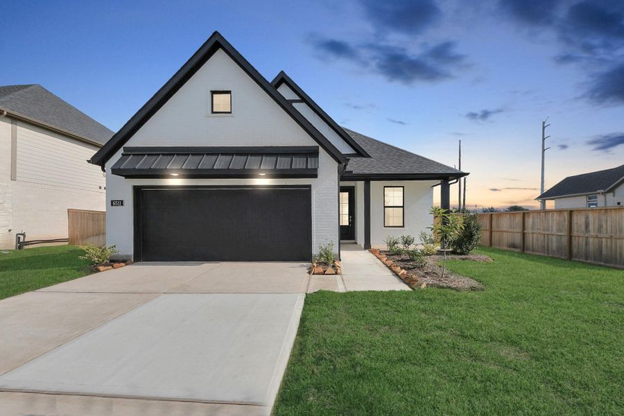 Front exterior of a new home in Arabella on the Prairie: Premier Collection, Richmond, TX, highlighting curb appeal (Image 13). Front exterior of a new home in Arabella on the Prairie: Premier Collection, Richmond, TX, highlighting curb appeal (Image 13).