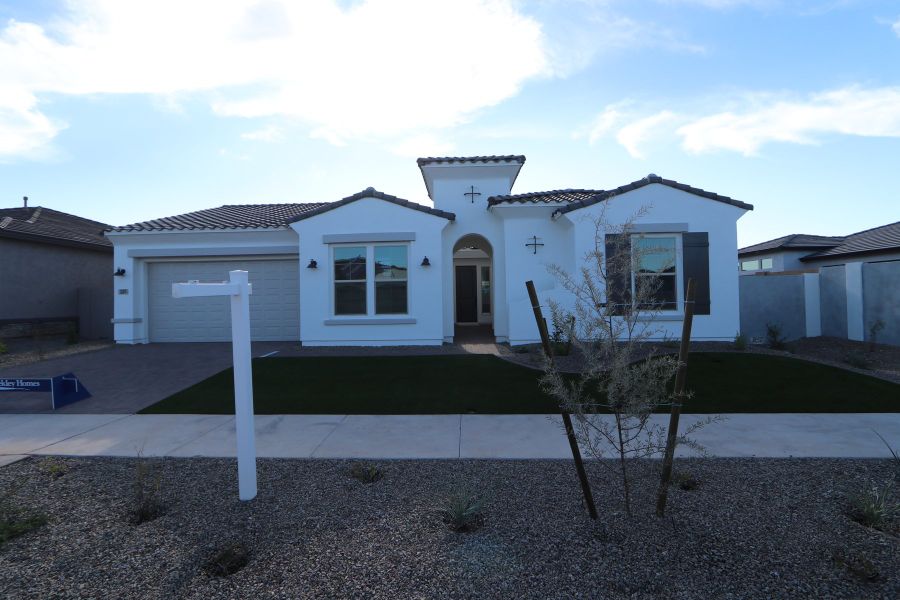 Front exterior of a new home in Escena at Blossom Rock, Apache Junction, AZ, highlighting curb appeal (Image 10). Front exterior of a new home in Escena at Blossom Rock, Apache Junction, AZ, highlighting curb appeal (Image 10).
