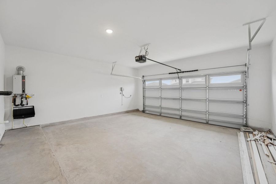 Garage featuring a garage door opener