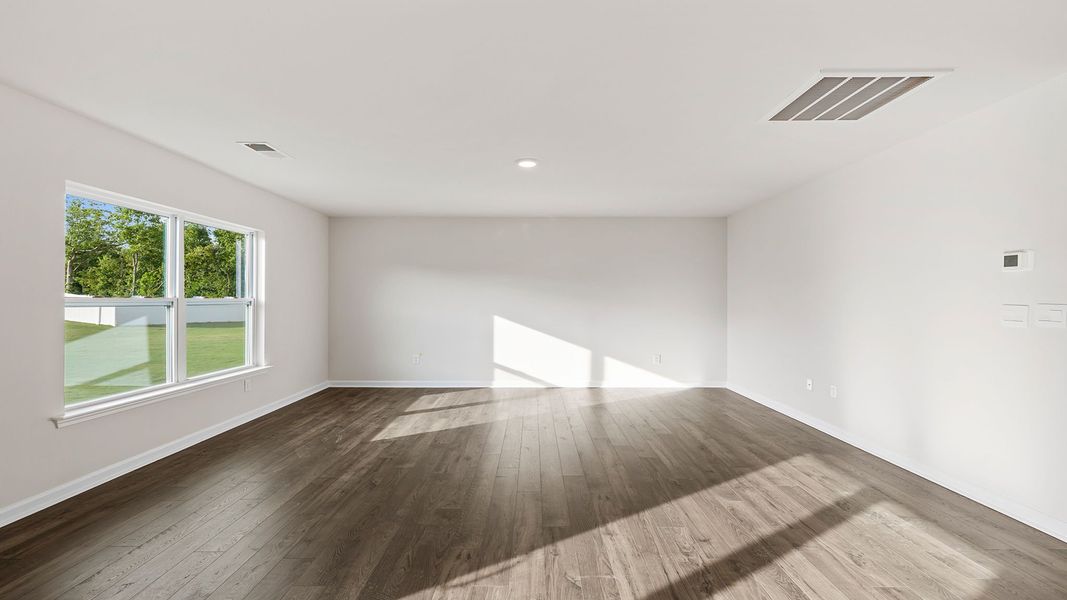 Spacious, unfurnished interior of a new home in Bentley Park, Greenwood (Image 21).