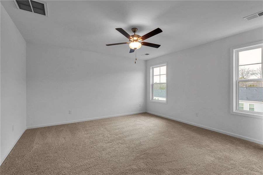 This spacious room offers comfortable carpeting an This spacious room offers comfortable carpeting an