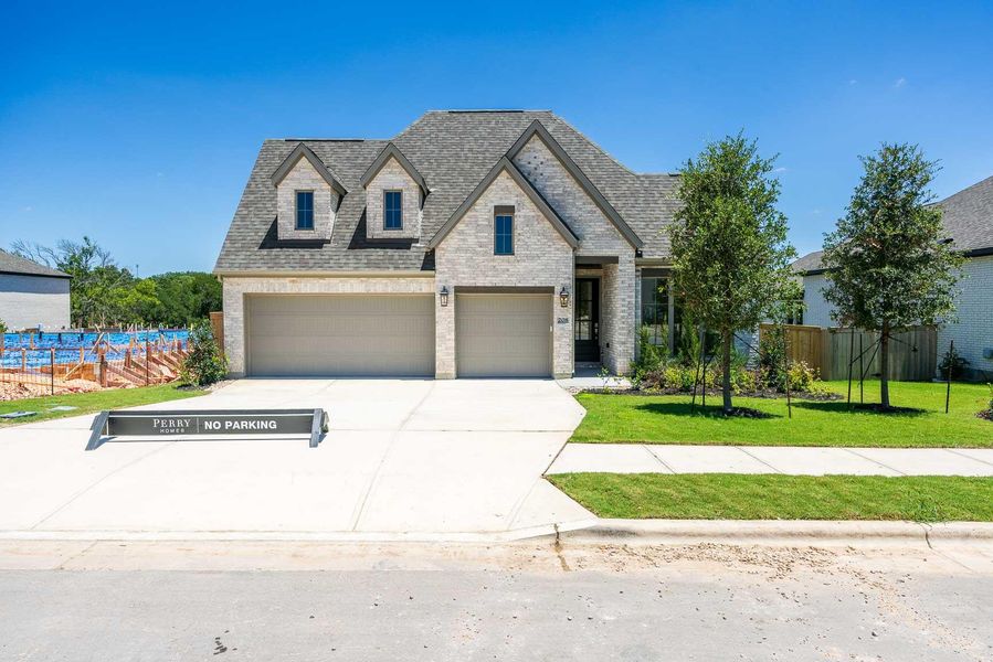 View of front of property featuring brick siding, a shingled roof, driveway, and an attached garage View of front of property featuring brick siding, a shingled roof, driveway, and an attached garage