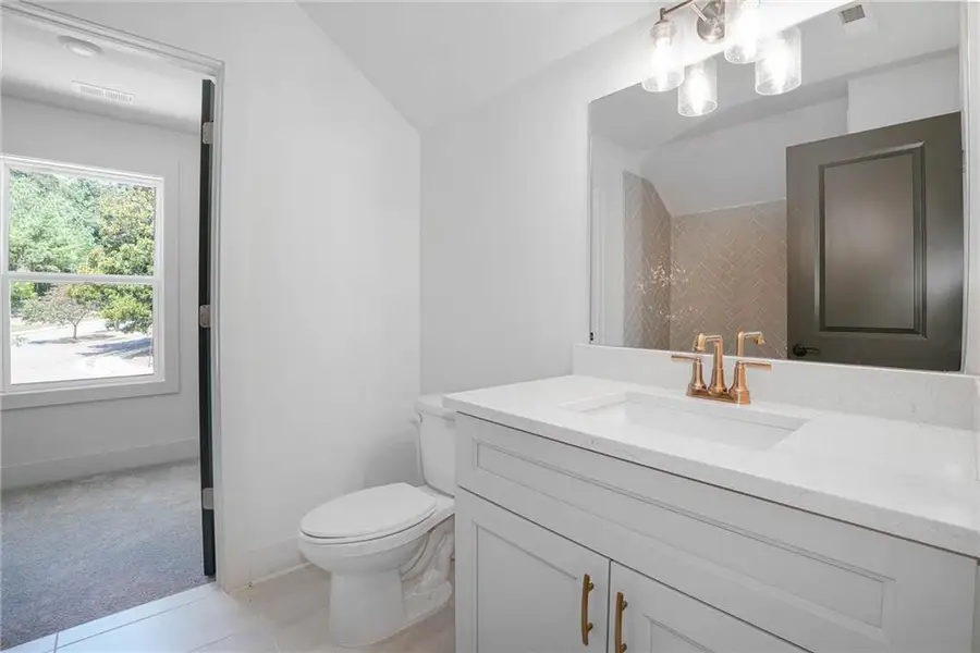 Furnished interior view inside a new home in Steeplechase, Hoschton (Image 6).