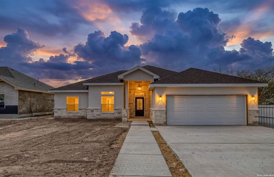 Front exterior of a new home in , Uvalde, TX, highlighting curb appeal (Image 20).