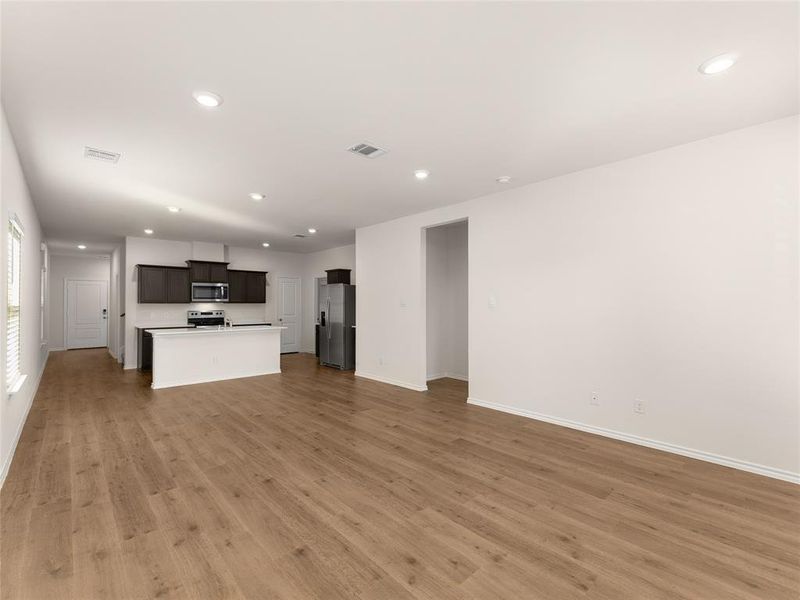 Unfurnished living room featuring light hardwood / wood-style floors