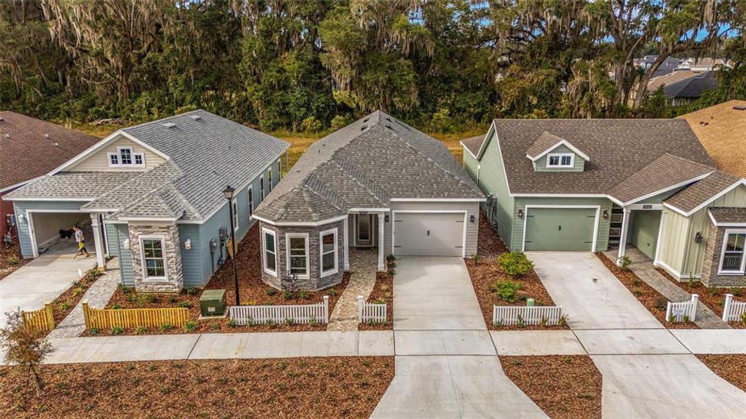 Front exterior of a new home in Fairway Pointe at West End, Newberry, FL, highlighting curb appeal (Image 20).