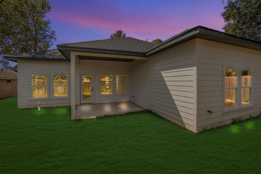 Backyard with a covered patio. Perfect for outdoor relaxation