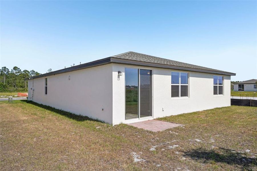 Exterior details and patio area of a home in Lake Deer Estates - Signature Series, Poinciana (Image 25). Exterior details and patio area of a home in Lake Deer Estates - Signature Series, Poinciana (Image 25).