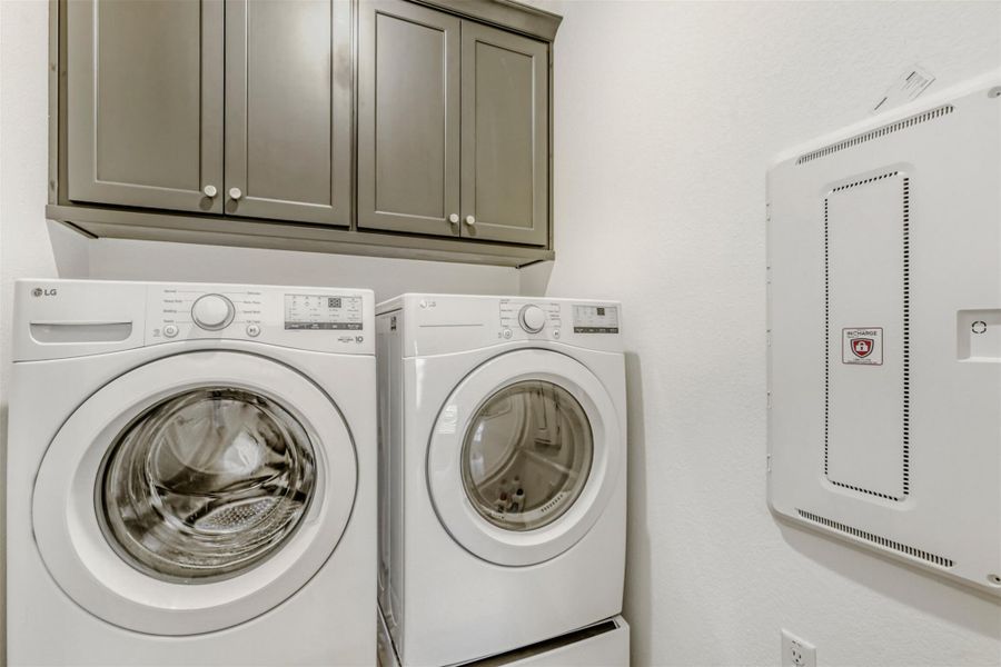 Laundry area with washing machine and clothes dryer and cabinet space
