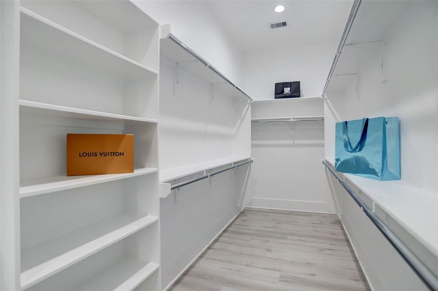 Spacious walk-in closet with ample storage.