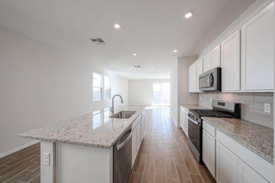 A kitchen with white cabinets. A kitchen with white cabinets.