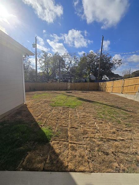 View of fenced backyard