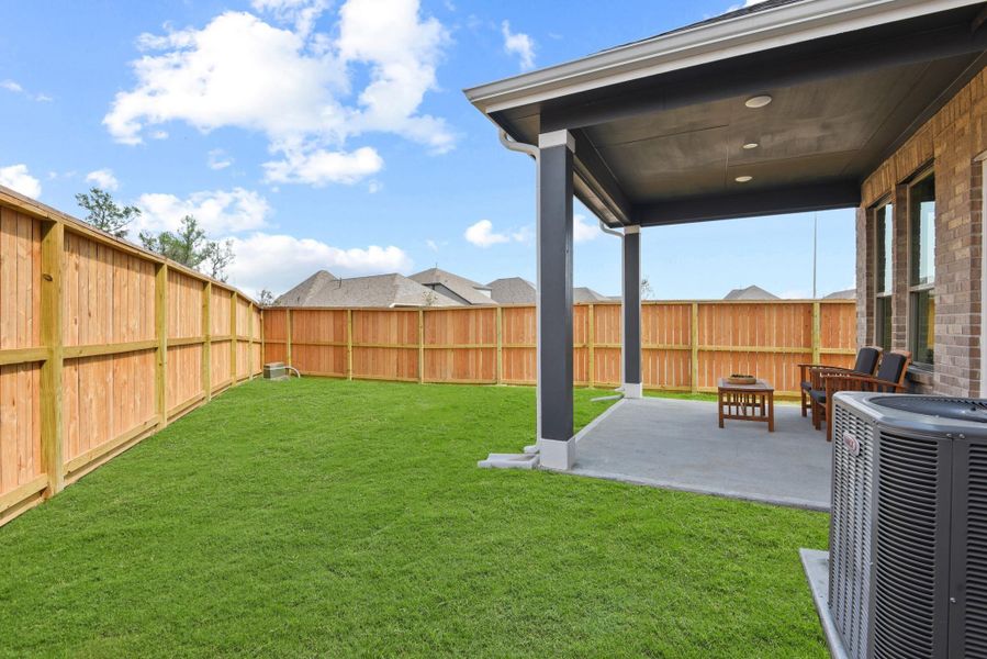 Exterior details and patio area of a home in The Groves, Humble (Image 19). Exterior details and patio area of a home in The Groves, Humble (Image 19).