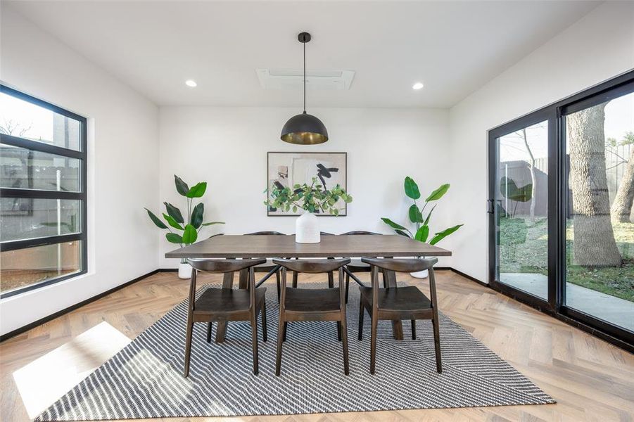 Dining room featuring recessed lighting and baseboards Dining room featuring recessed lighting and baseboards