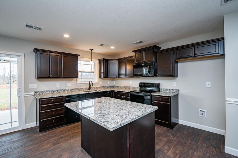 Representative furnished interior of a home built from the Saxon by Enchanted Homes in Guadalupe Heights, Seguin (Image 12).