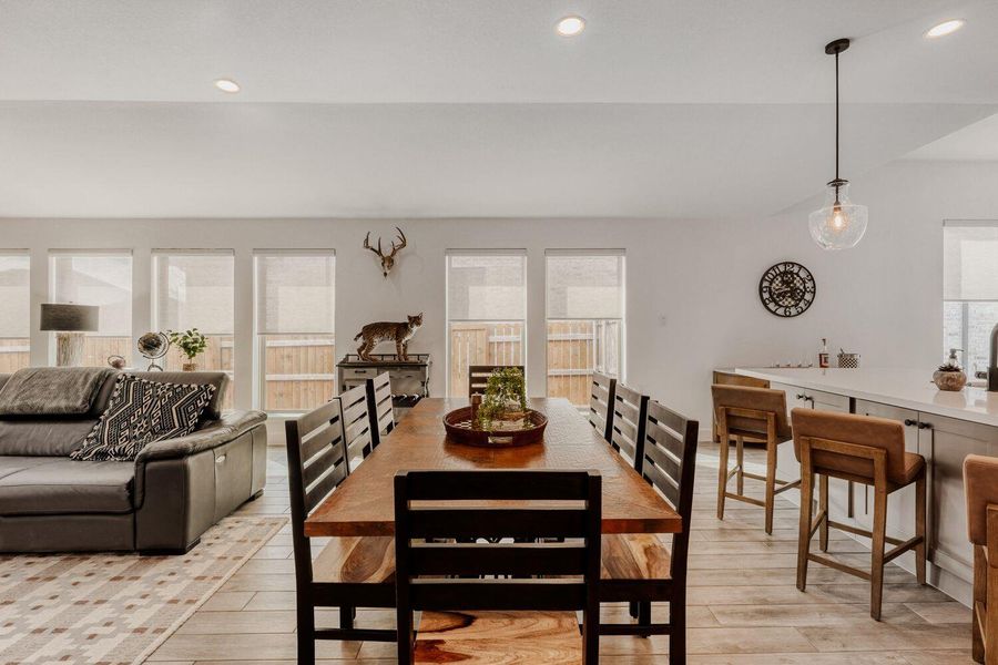 Dining space featuring recessed lighting and light wood-style flooring
