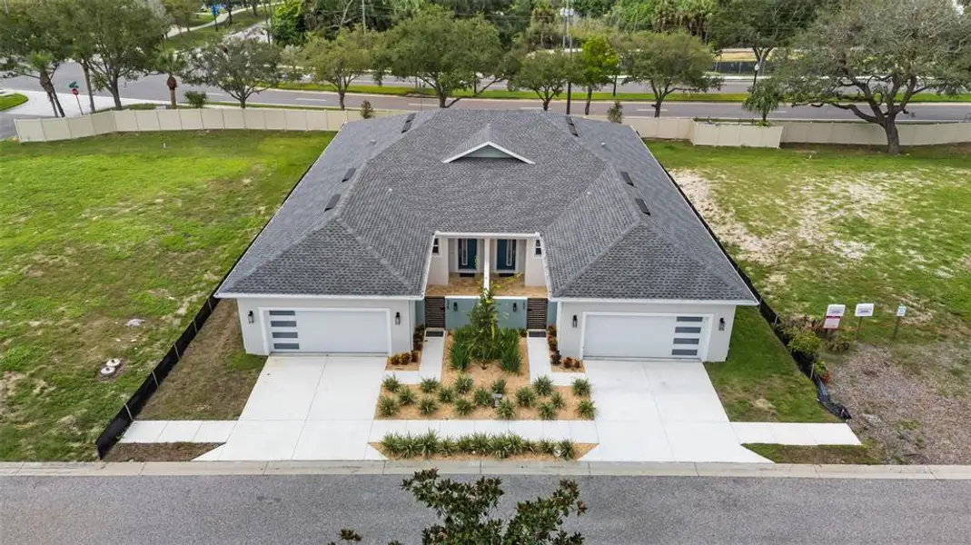Front exterior of a new home in , Tarpon Springs, FL, highlighting curb appeal (Image 21).