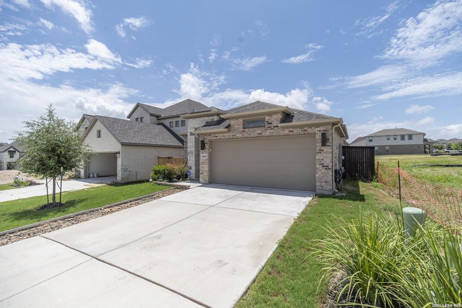 Front exterior of a new home in Ladera, San Antonio, TX, highlighting curb appeal (Image 22). Front exterior of a new home in Ladera, San Antonio, TX, highlighting curb appeal (Image 22).