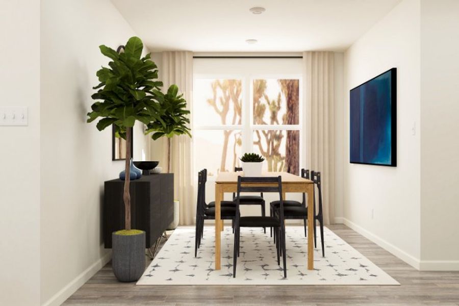 A dining room with a table and chairs.