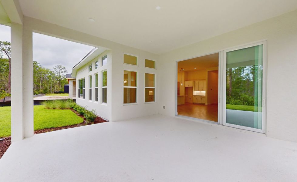Exterior details and patio area of a home in Woodhaven, Port Orange (Image 18).