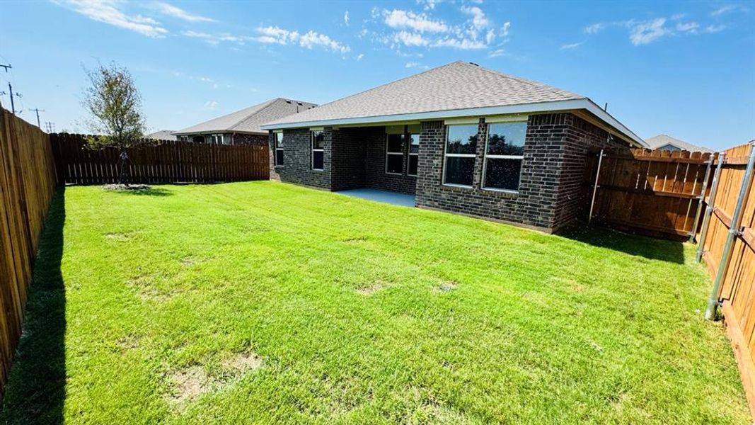 Front exterior of a new home in Meadowbrook Estates, Cleburne, TX, highlighting curb appeal (Image 14). Front exterior of a new home in Meadowbrook Estates, Cleburne, TX, highlighting curb appeal (Image 14).