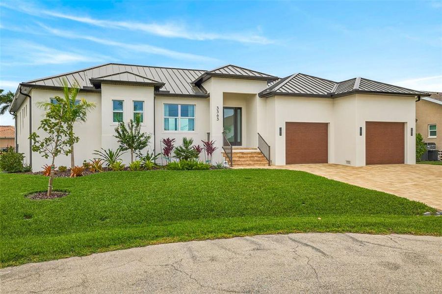Front exterior of a new home in , Punta Gorda, FL, highlighting curb appeal (Image 2). Front exterior of a new home in , Punta Gorda, FL, highlighting curb appeal (Image 2).