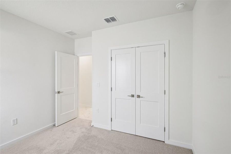 Spacious, unfurnished interior of a new home in Grasslands West, Lakeland (Image 22).