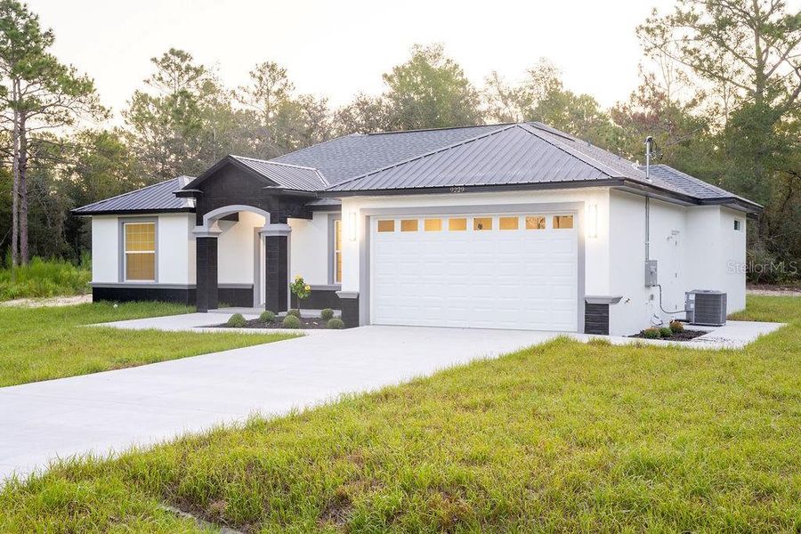 Front exterior of a new home in , Dunnellon, FL, highlighting curb appeal (Image 24). Front exterior of a new home in , Dunnellon, FL, highlighting curb appeal (Image 24).