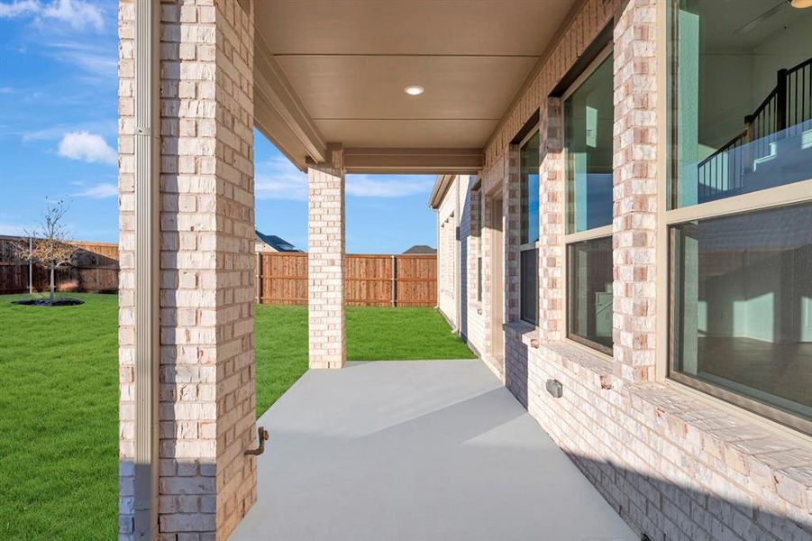 Exterior details and patio area of a home in Lily Creek at Sutton Fields, Aubrey (Image 25).