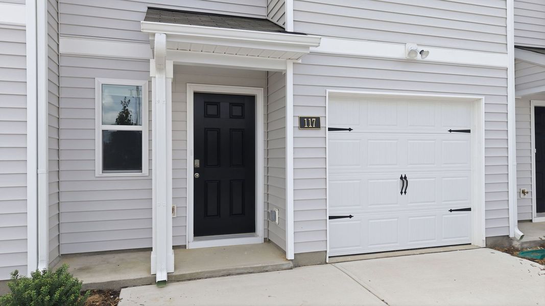 Exterior details and patio area of a home in The Townes at Hunter Hill, Rocky Mount (Image 3).