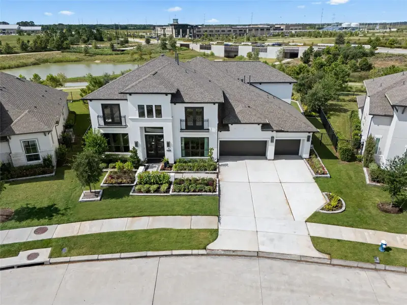 Front exterior of a new home in Bridgeland, Cypress, TX, highlighting curb appeal (Image 22).