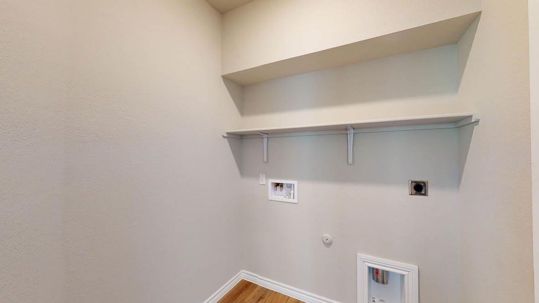 Laundry room with hookup for a gas dryer, light wood-style floors, washer hookup, and electric dryer hookup