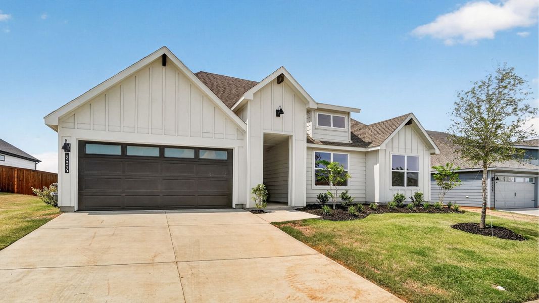 Front exterior of a new home in Sandstone Estates, Granbury, TX, highlighting curb appeal (Image 15).