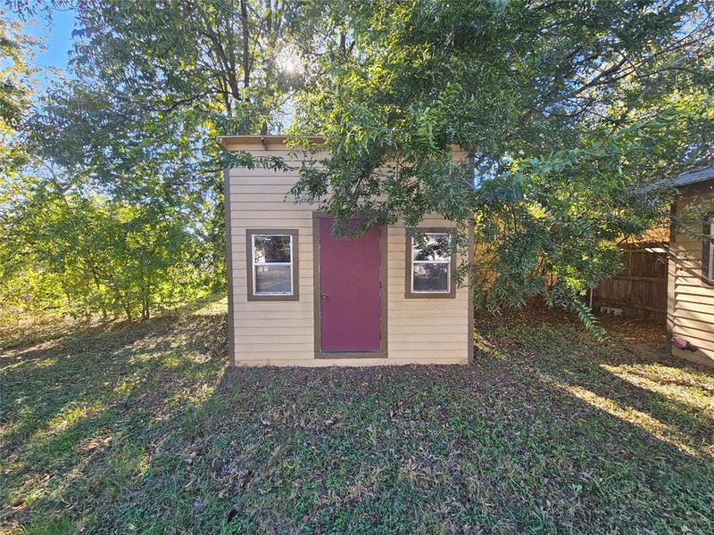 View of outdoor structure with a yard View of outdoor structure with a yard