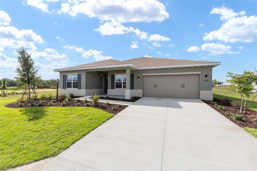 Front exterior of a new home in , Ocala, FL, highlighting curb appeal (Image 20).