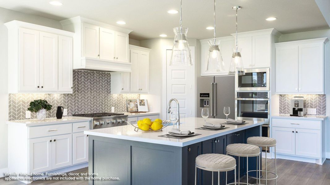Kitchen featuring decorative backsplash, white cabinets, stainless steel appliances, a center island with sink, and light stone countertops Kitchen featuring decorative backsplash, white cabinets, stainless steel appliances, a center island with sink, and light stone countertops