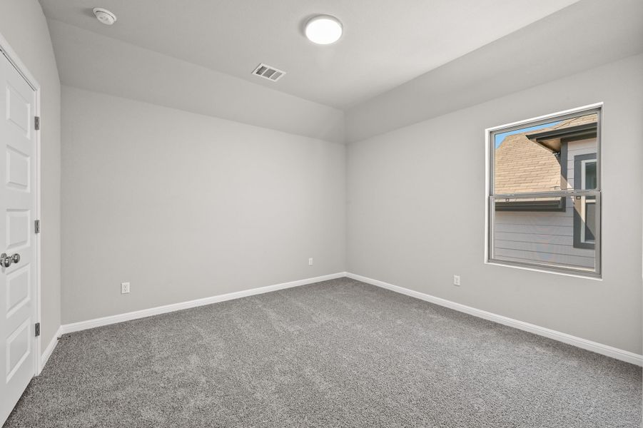 Bedroom in the Willow home plan by Trophy Signature Homes – REPRESENTATIVE PHOTO