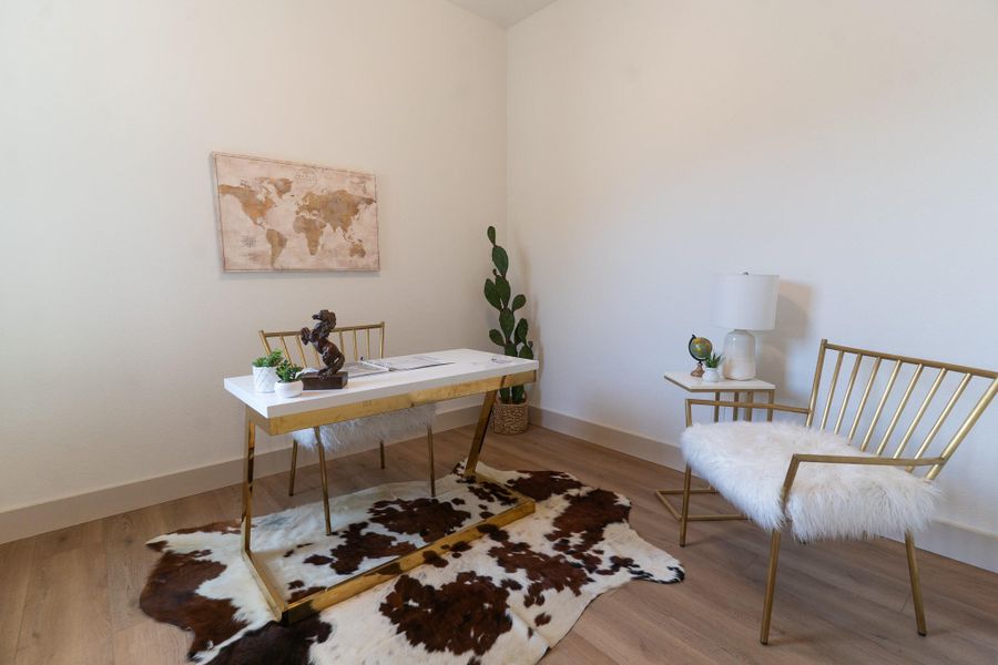 Office featuring wood finished floors and baseboards Office featuring wood finished floors and baseboards