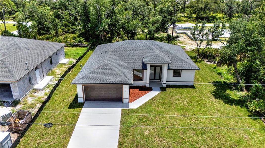 Front exterior of a new home in , Port Charlotte, FL, highlighting curb appeal (Image 27).