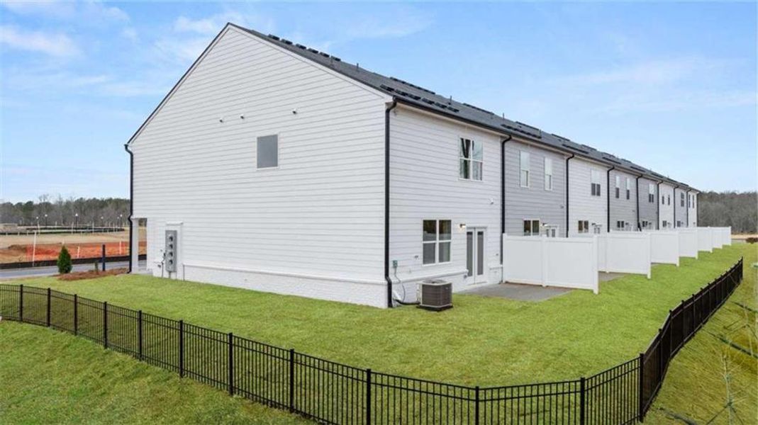 Exterior details and patio area of a home in Echo Glen, Stockbridge (Image 27).