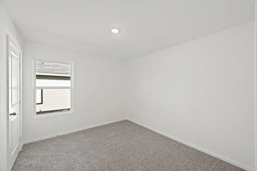 Spacious, unfurnished interior of a new home in The Canopies, Splendora (Image 17).