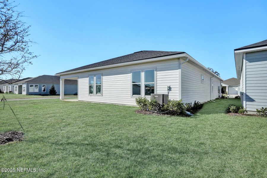 Front exterior of a new home in Reverie at Silverleaf, St. Augustine, FL, highlighting curb appeal (Image 14). Front exterior of a new home in Reverie at Silverleaf, St. Augustine, FL, highlighting curb appeal (Image 14).