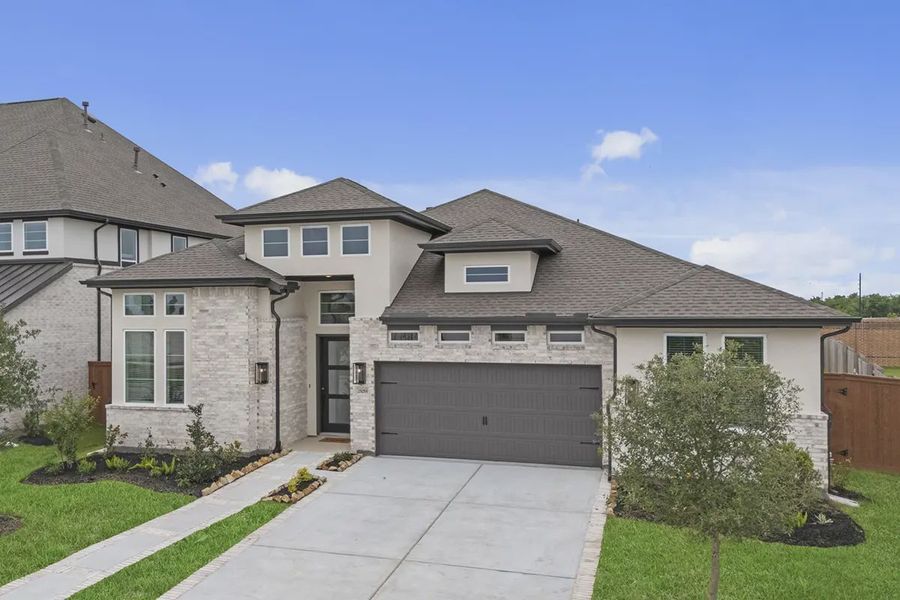 Representative exterior photo of a completed home built from the Sweetwater by Chesmar Homes in Steward Estates, Conroe, TX (Image 24). Representative exterior photo of a completed home built from the Sweetwater by Chesmar Homes in Steward Estates, Conroe, TX (Image 24).