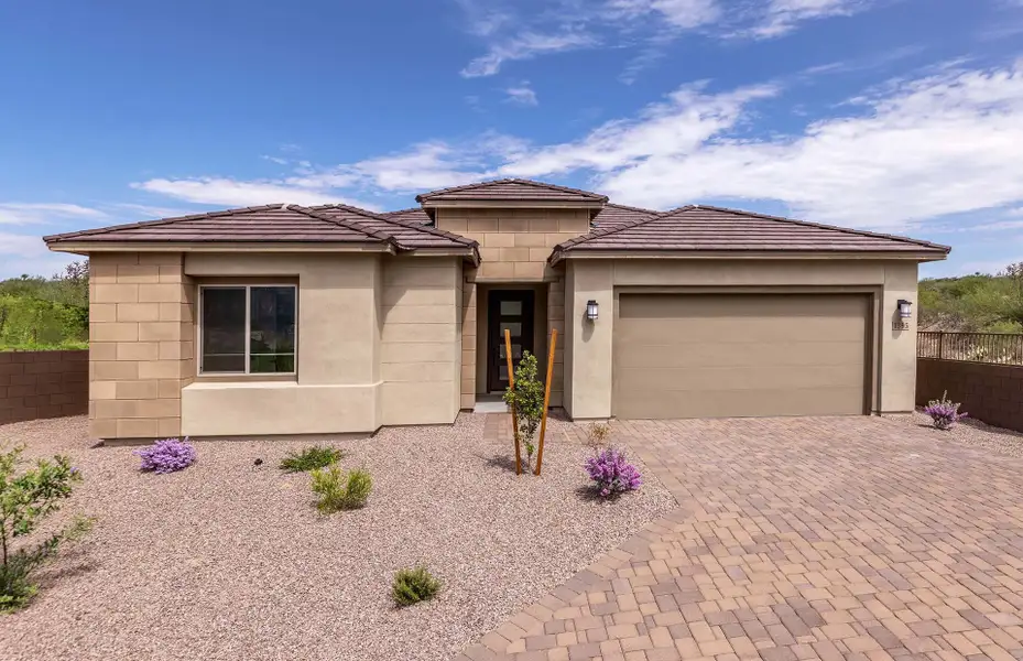 Front exterior of a new home in Vistoso Canyon Estates, Oro Valley, AZ, highlighting curb appeal (Image 1). Front exterior of a new home in Vistoso Canyon Estates, Oro Valley, AZ, highlighting curb appeal (Image 1).