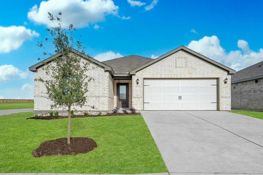 View of front of house featuring a garage and a front yard