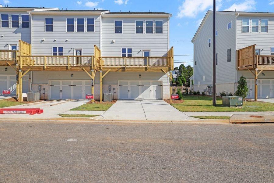 Front exterior of a new home in Somerset at Veterans Memorial, Mableton, GA, highlighting curb appeal (Image 21). Front exterior of a new home in Somerset at Veterans Memorial, Mableton, GA, highlighting curb appeal (Image 21).
