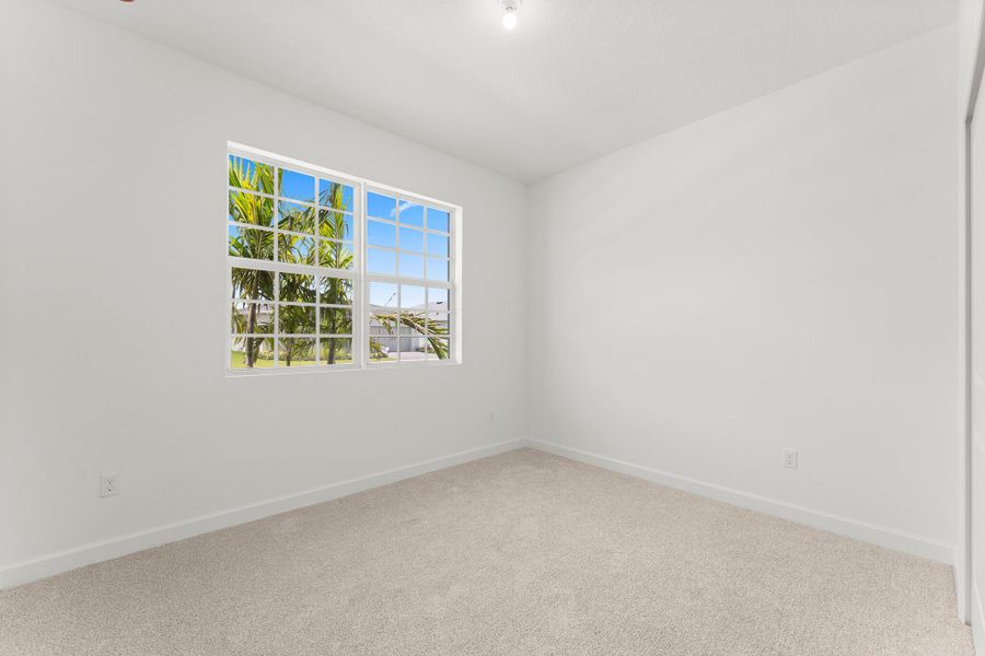 Spacious, unfurnished interior of a new home in Tradition - Cadence, Port St. Lucie (Image 11).