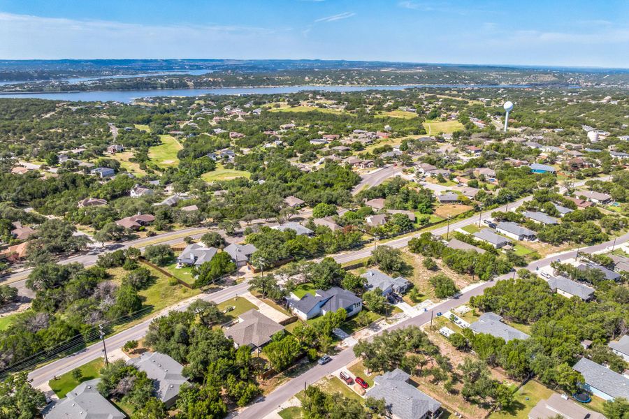 Aerial view of residential area featuring a large body of water