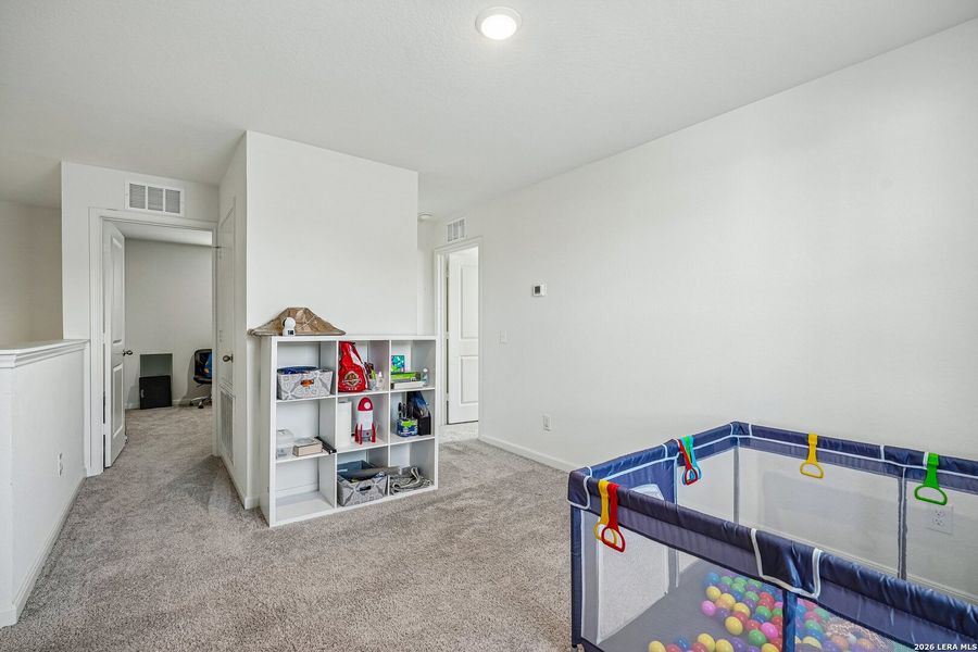 Furnished interior view inside a new home in Hennersby Hollow, San Antonio (Image 13).